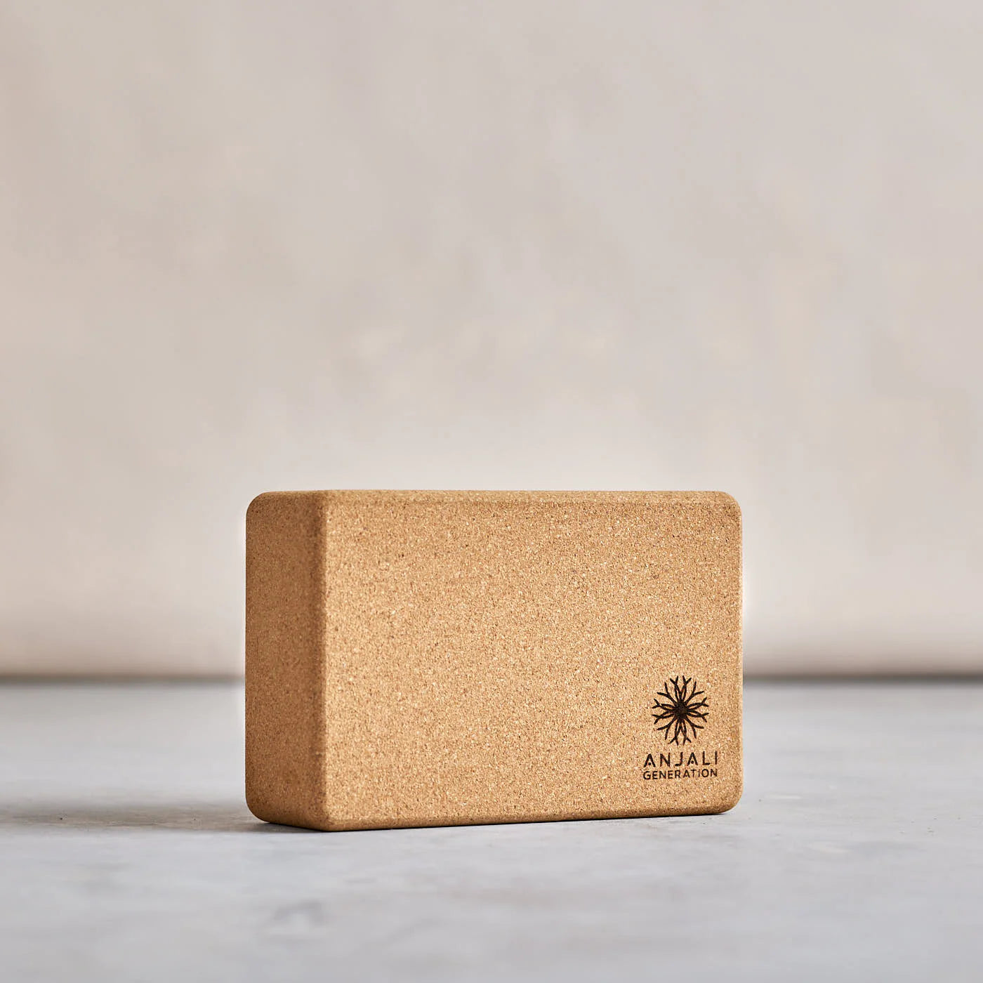 Eco-friendly Anjali Generation Cork Yoga Block with non-slip grip for balance and comfort in yoga poses.