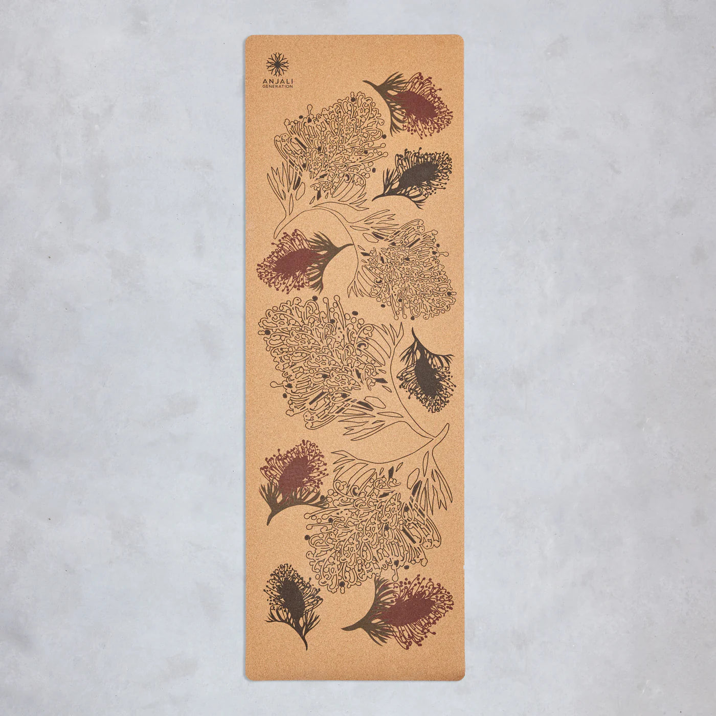 Anjali Generation cork yoga mat with grevillea floral design on a light gray background