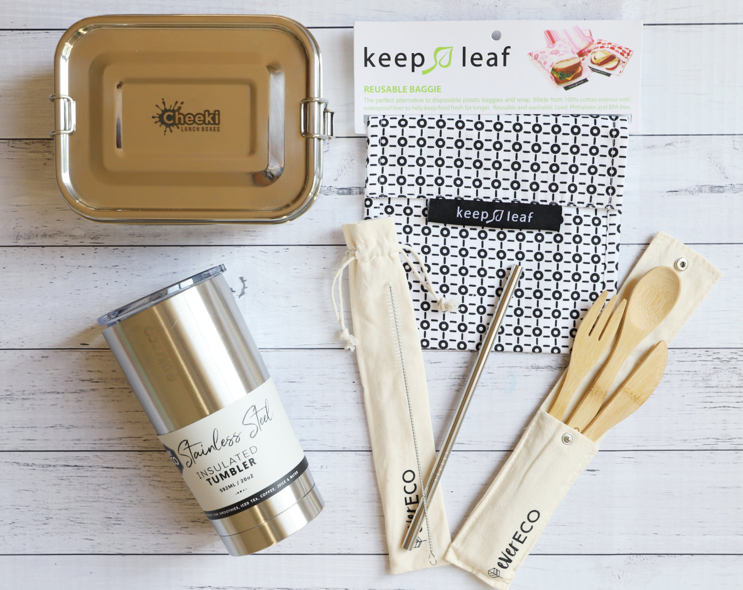 EcoLife Box zero waste lunchbox set of reusable items including a tumbler, lunch box, and utensils on a wooden surface