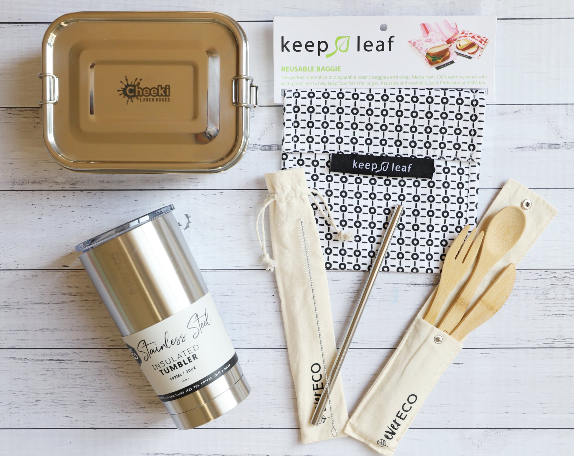 EcoLife Box zero waste lunchbox set of reusable items including a tumbler, lunch box, and utensils on a wooden surface