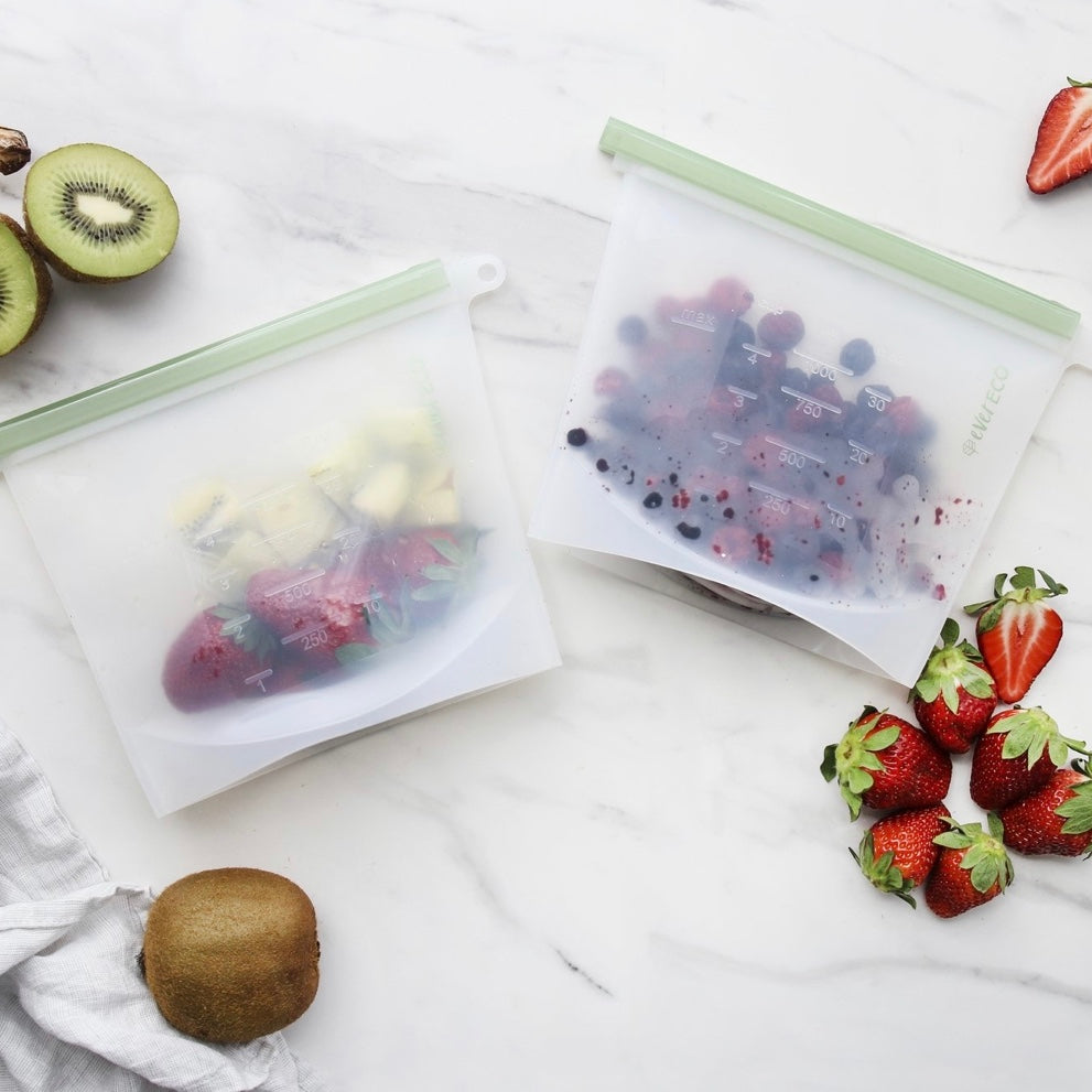 Ever Eco Clear silicone reusable food pouches with fruits on a white surface