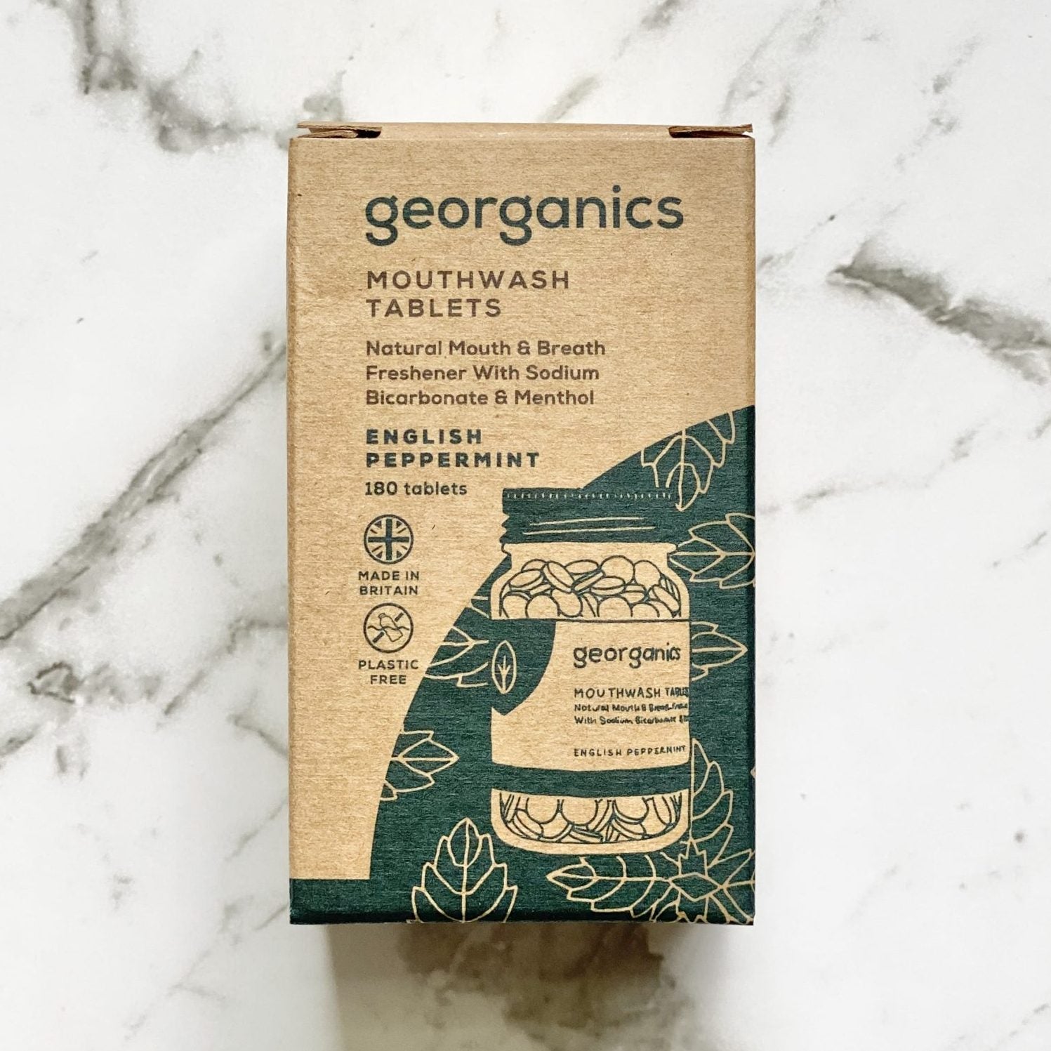 Georganics English peppermint mouthwash tablets packaging on a marble surface