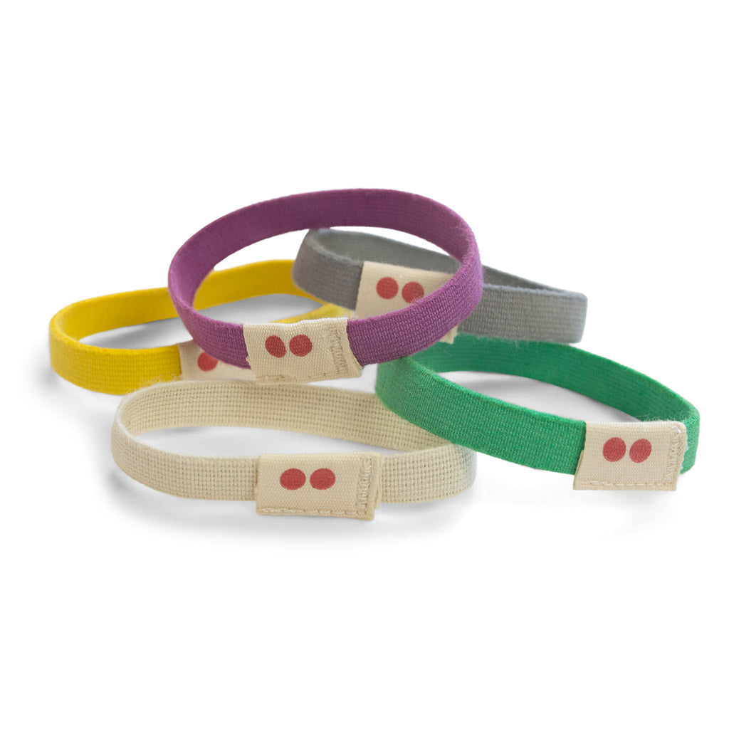 Set of colorful Kooshoo organic hairties on a white background