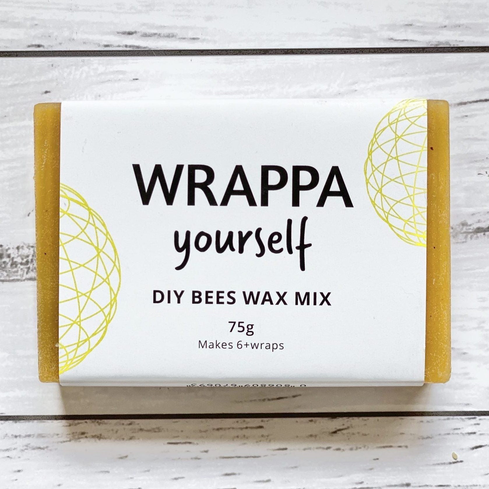 Block of WRAPPA Beeswax for DIY wax wraps on a wooden surface