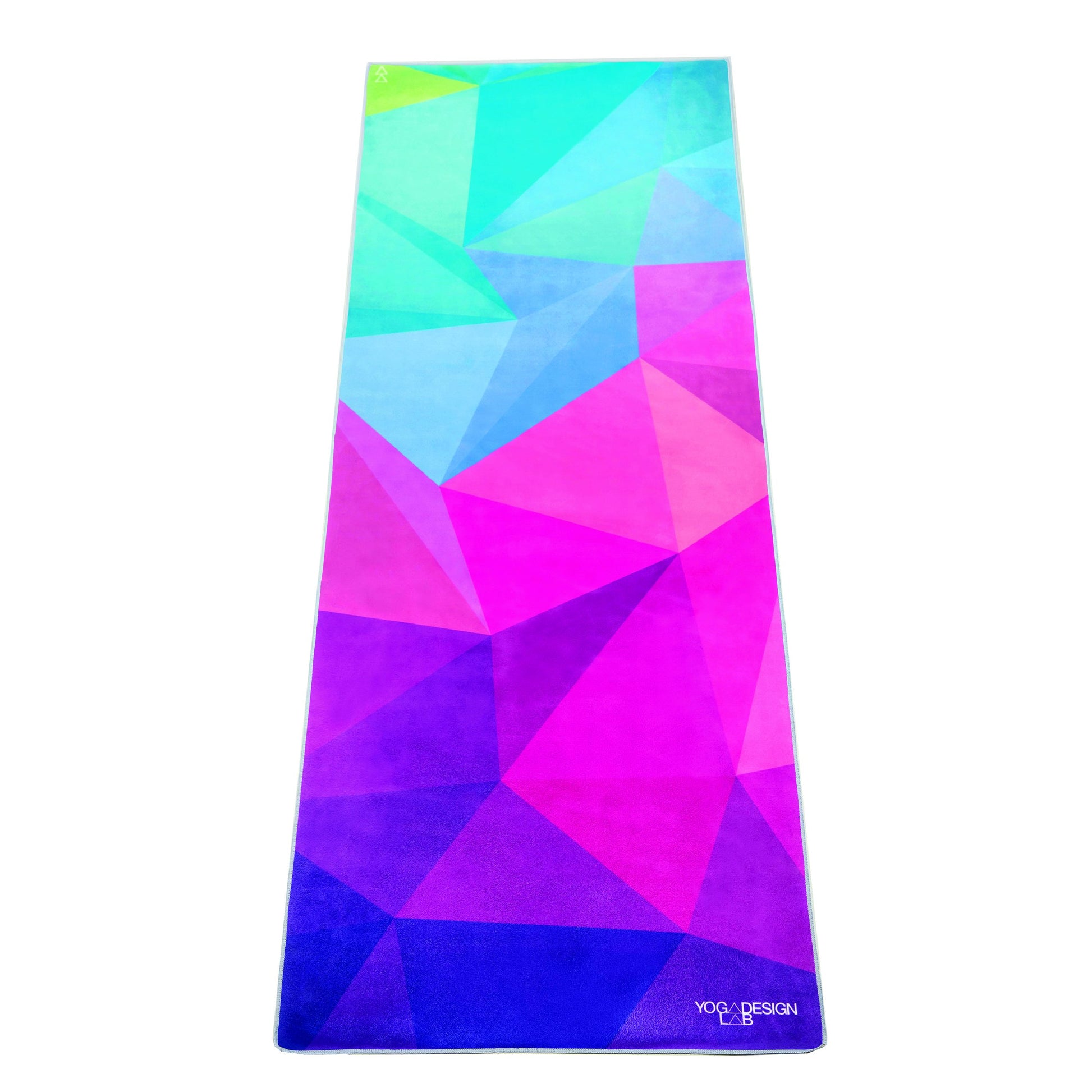 Colourful geometric-patterned Yoga Design Lab yoga mat towel on a white background