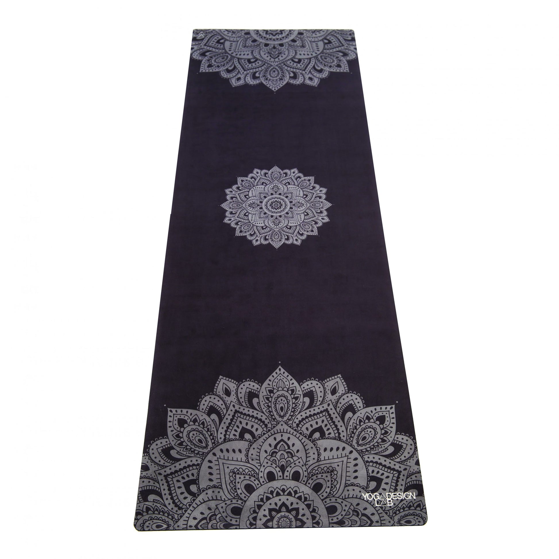 Black Yoga Design Lab combo mat with gray mandala patterns on a white background
