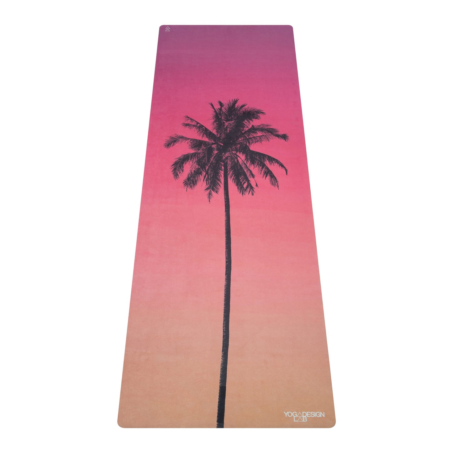 Yoga Design Lab comb mat with a palm tree design and gradient pink to beige color on a white background