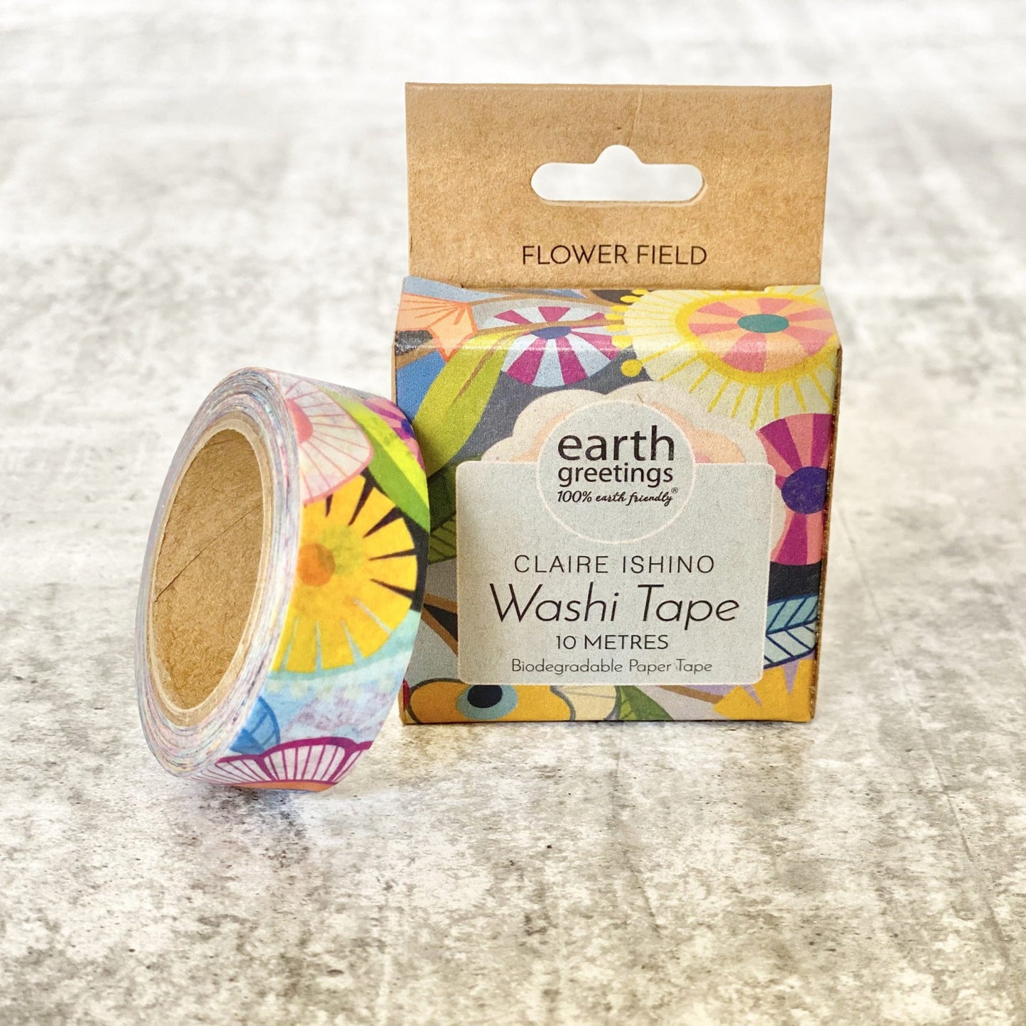 Colorful Earth Greetings Flower Field washi tape with packaging on a textured surface
