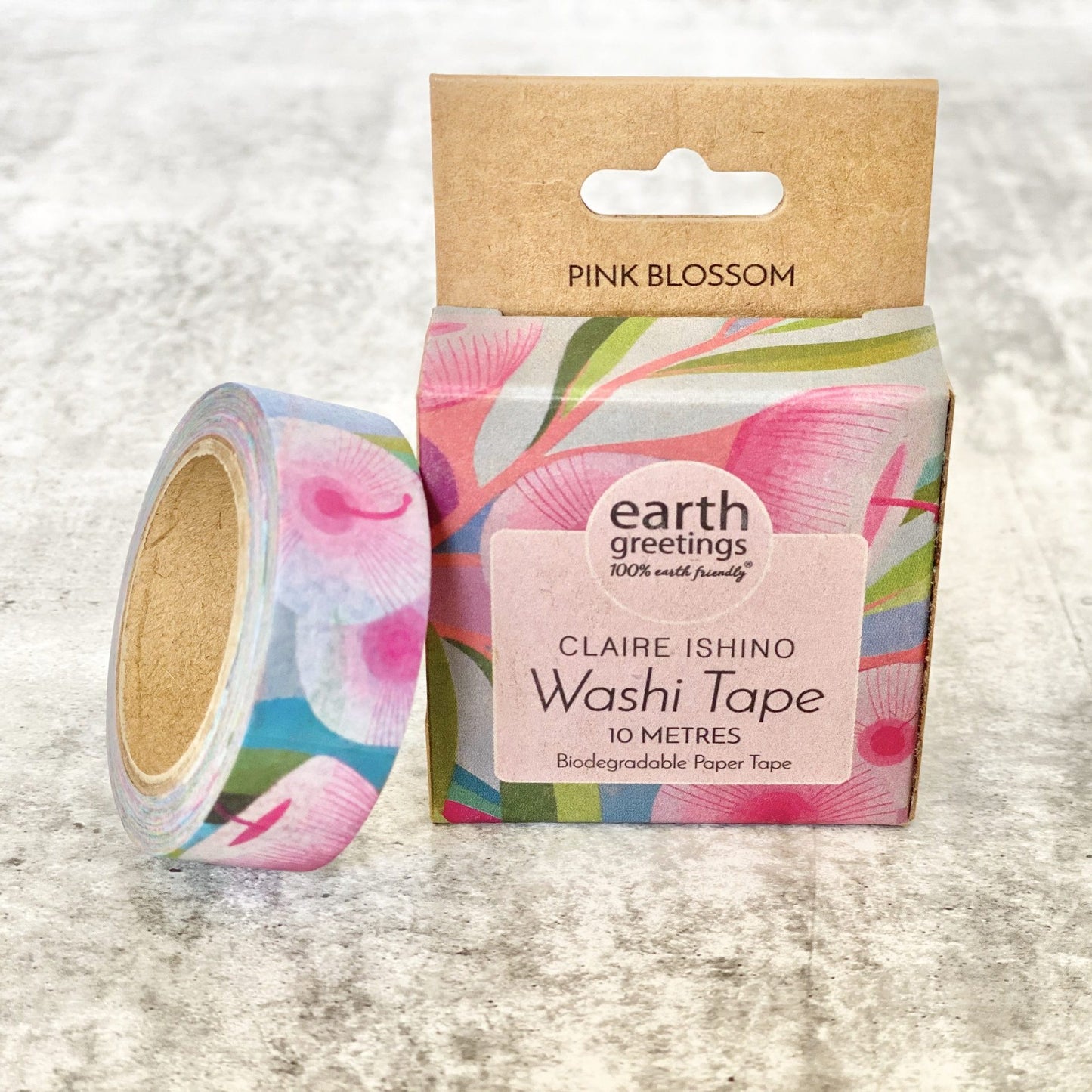 Earth Greetings Pink Blossom Washi tape with floral design and packaging on a textured surface