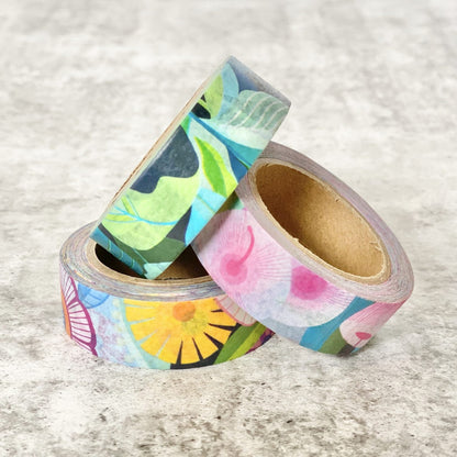 Three rolls of colorful floral Earth Greetings washi tape on a textured surface