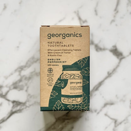 Georganics English peppermint natural toothpaste packaging on a marble background