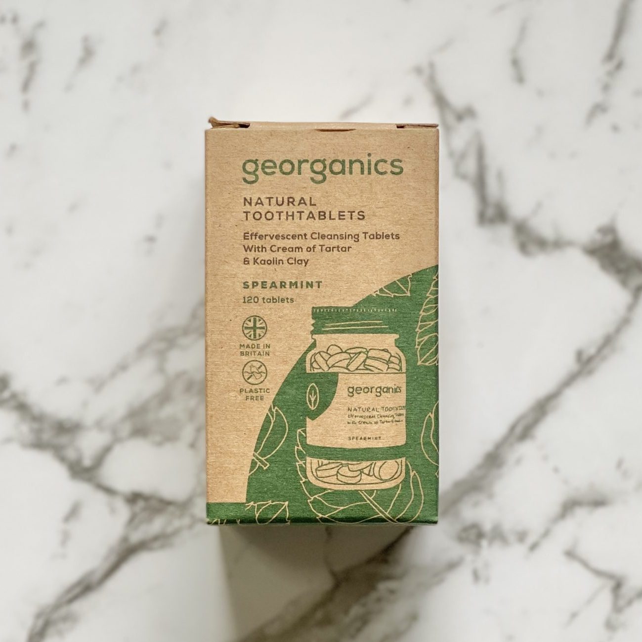 Georganics spearmint natural tooth tablets packaging on a marble background