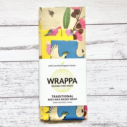 Pack of WRAPPA reusable beeswax food wraps with colourful design on a wooden surface