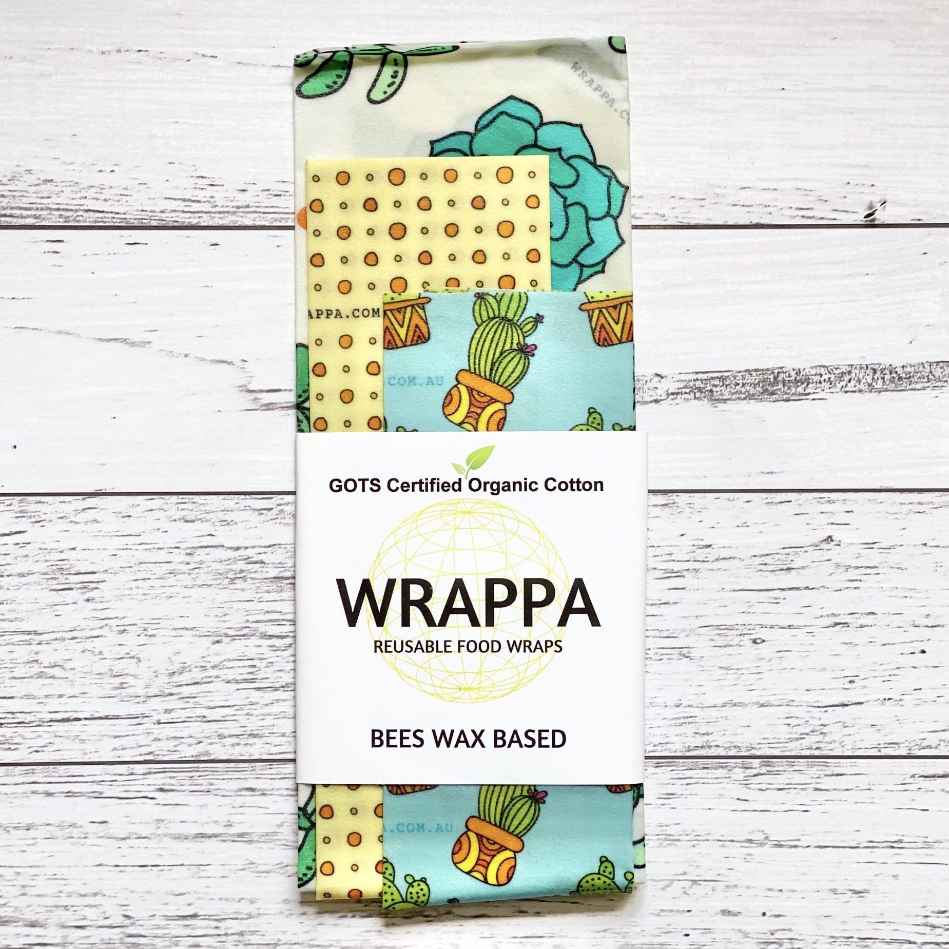 Pack of WRAPPA reusable beeswax food wraps with various patterns on a wooden surface