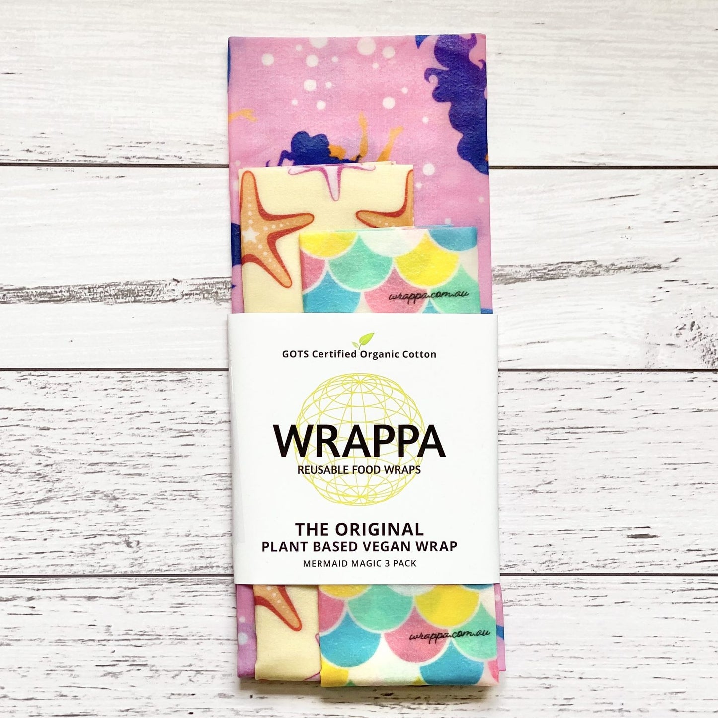 Pack of WRAPPA plant-based vegan reusable food wraps with mermaid-themed design on a wooden surface