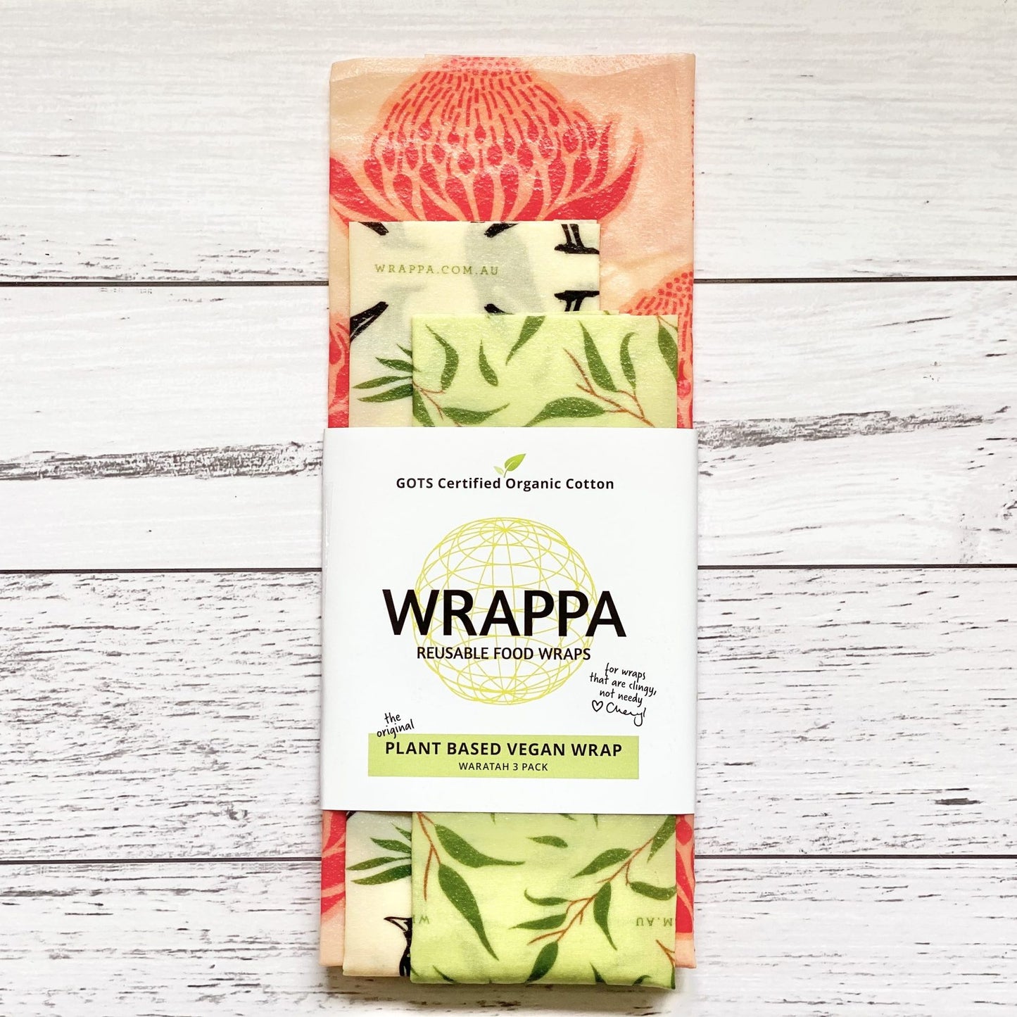 Pack of WRAPPA plant-based vegan reusable food wraps with native plant patterns on a wooden surface