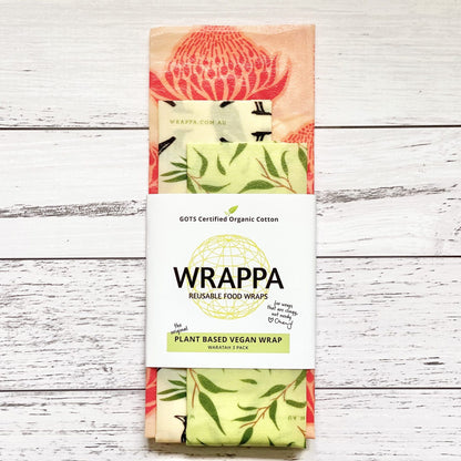 Pack of WRAPPA plant-based vegan reusable food wraps with native plant patterns on a wooden surface