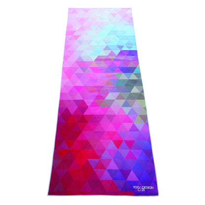 Colorful Yoga Design Lab yoga towel with geometric patterns on a white background